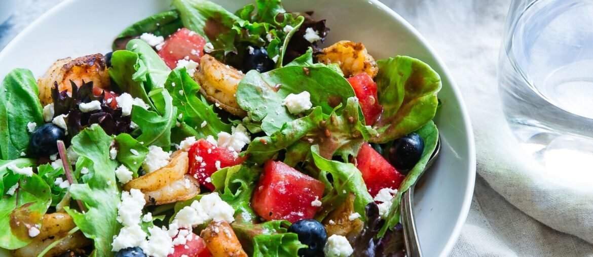 vegetable salad on white ceramic bowl