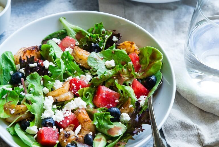 vegetable salad on white ceramic bowl